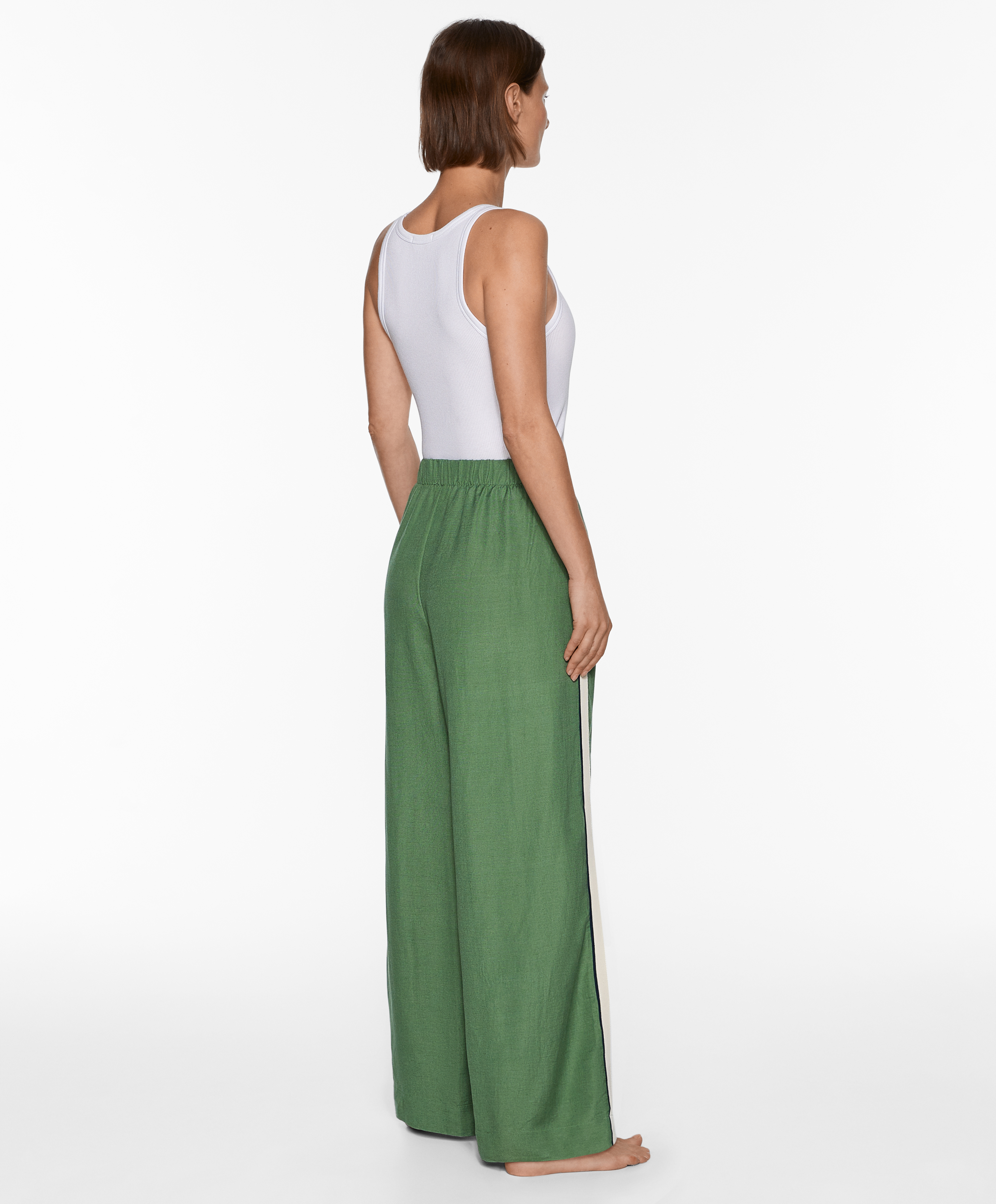 Trousers with linen appliqué along the sides