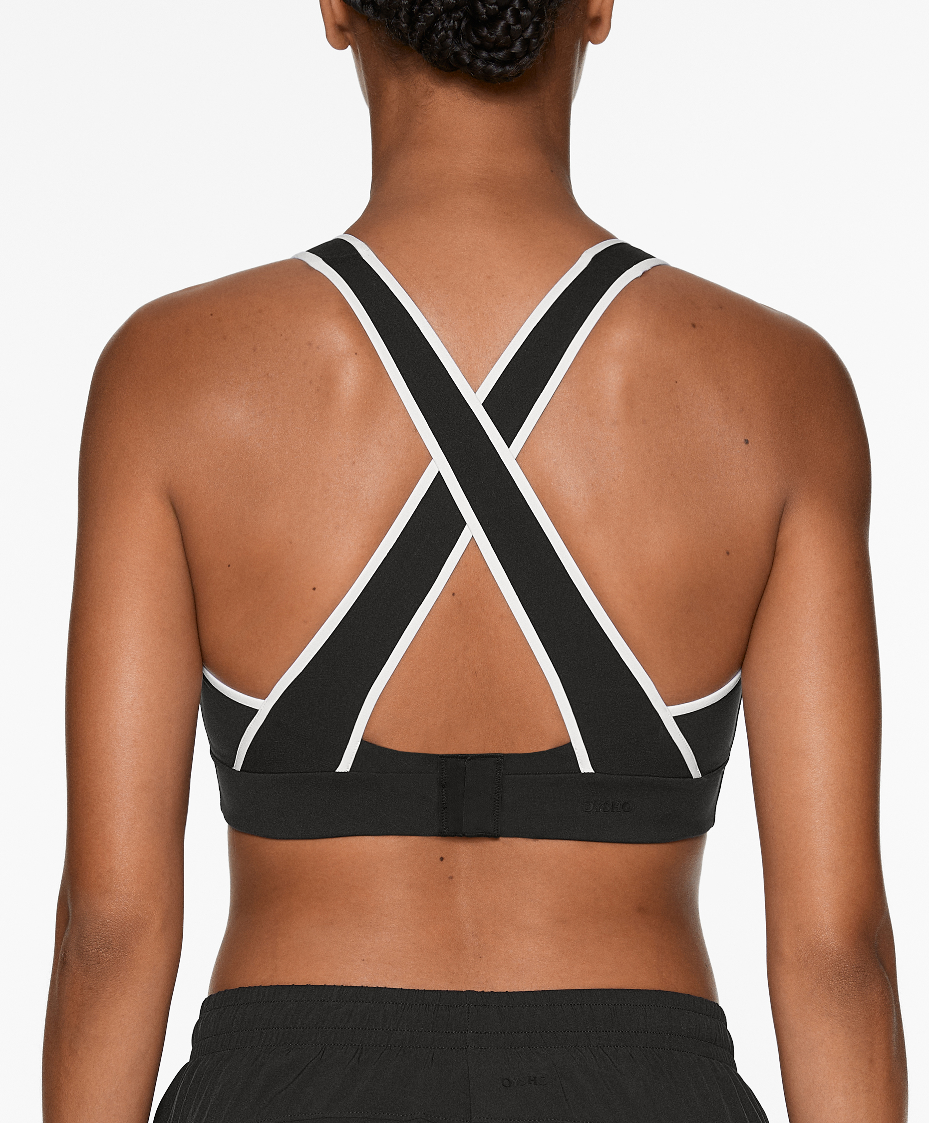 Firm support compressive sports bra with piping