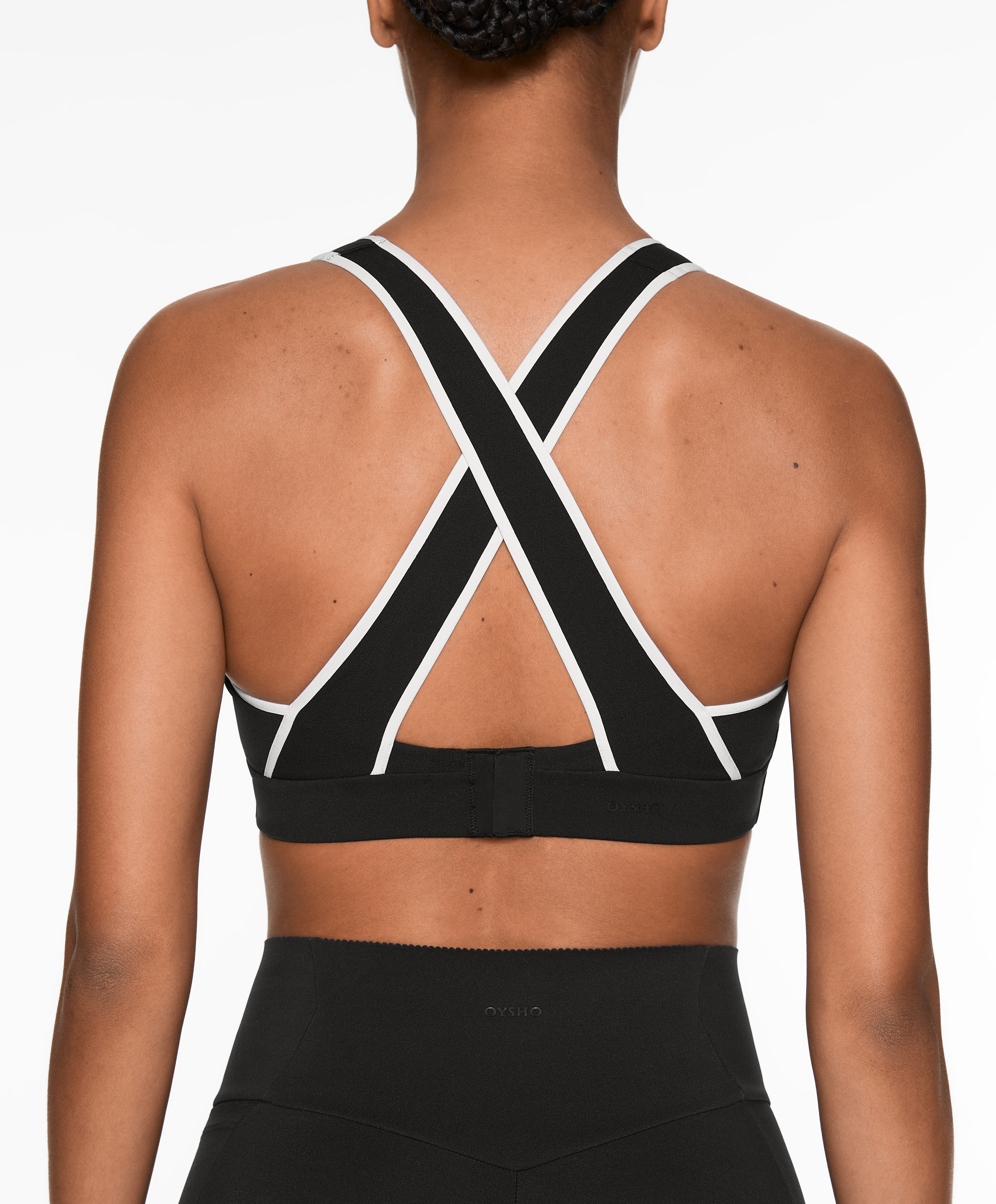 Firm support compressive sports bra with piping