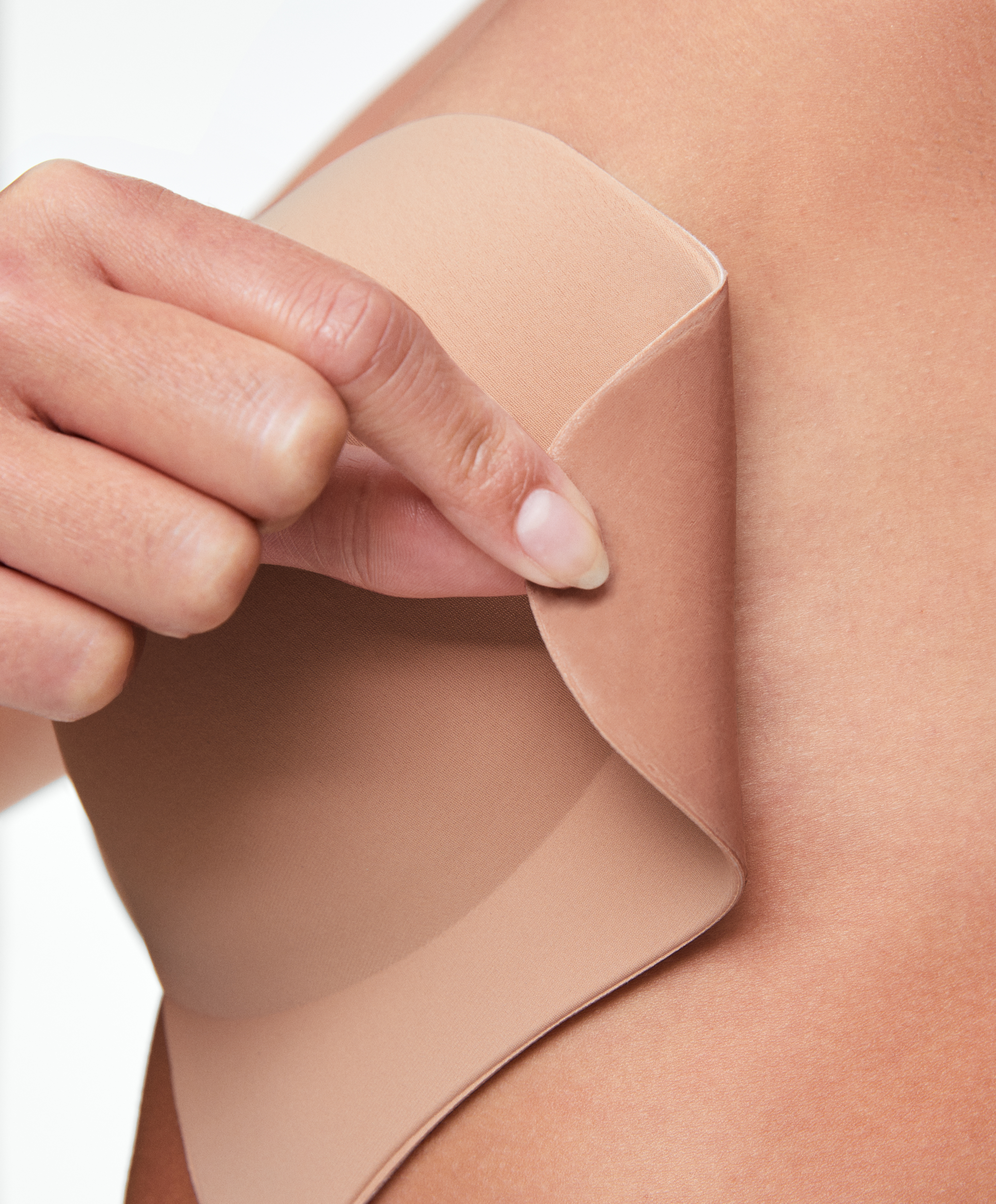 Enhancing fabric cups with adhesive sides