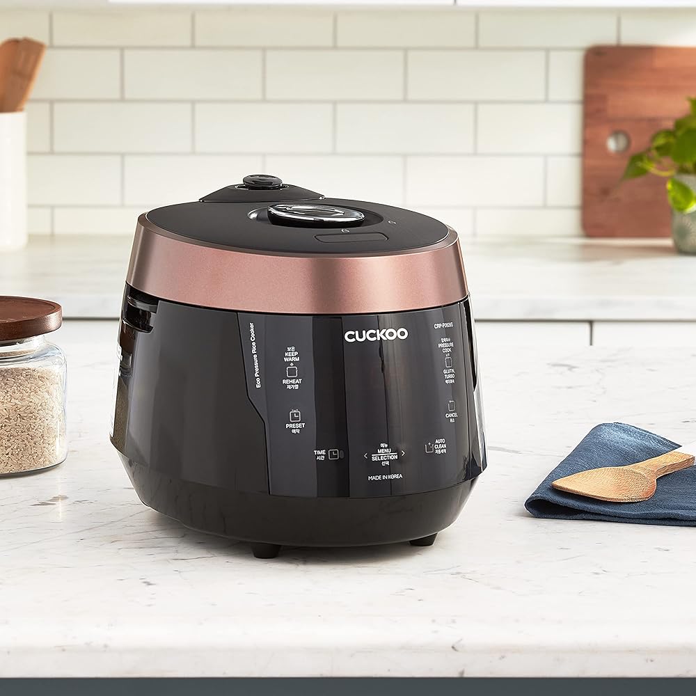 CUCKOO CRP-P0609S 6-Cup (Uncooked) / 12-Cup (Cooked) High Pressure Rice Cooker & Warmer with Nonstick Inner Pot, 12 Menu Options, Fuzzy Logic Tech, 3 Voice Guide, Auto Clean (Black/Copper): Home & Kitchen