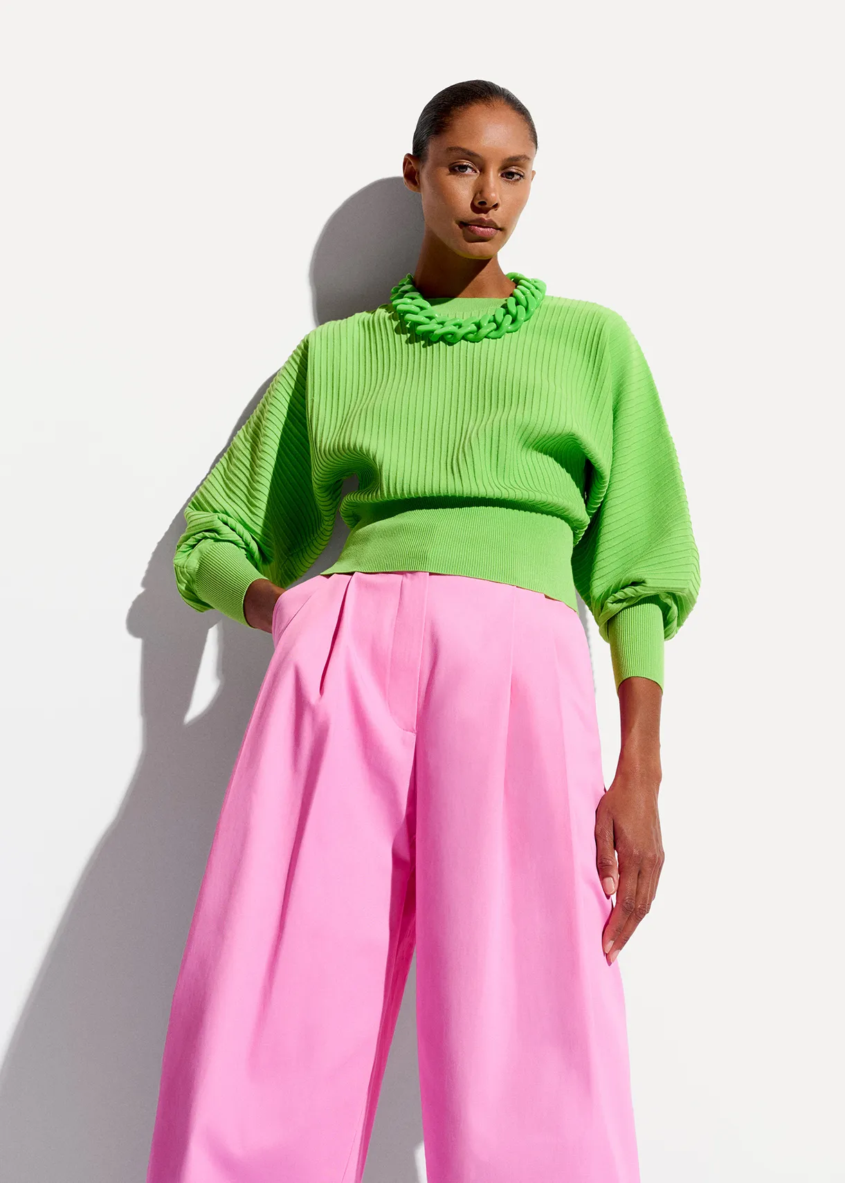 Green knitted sweater with fitted waist