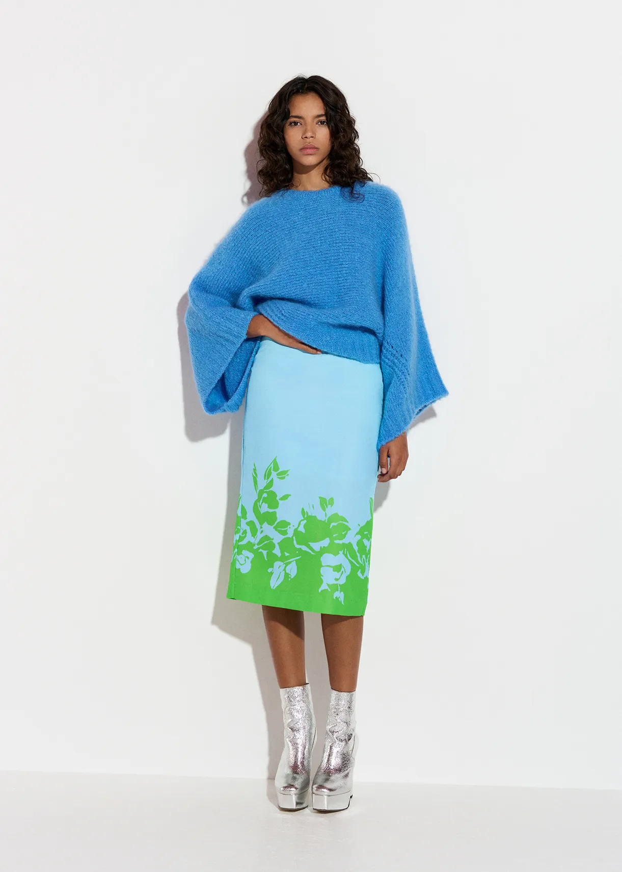 Blue knit sweater with cape effect