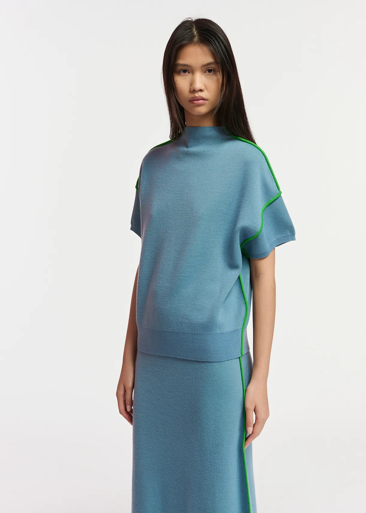 Blue short-sleeved sweater with green piping