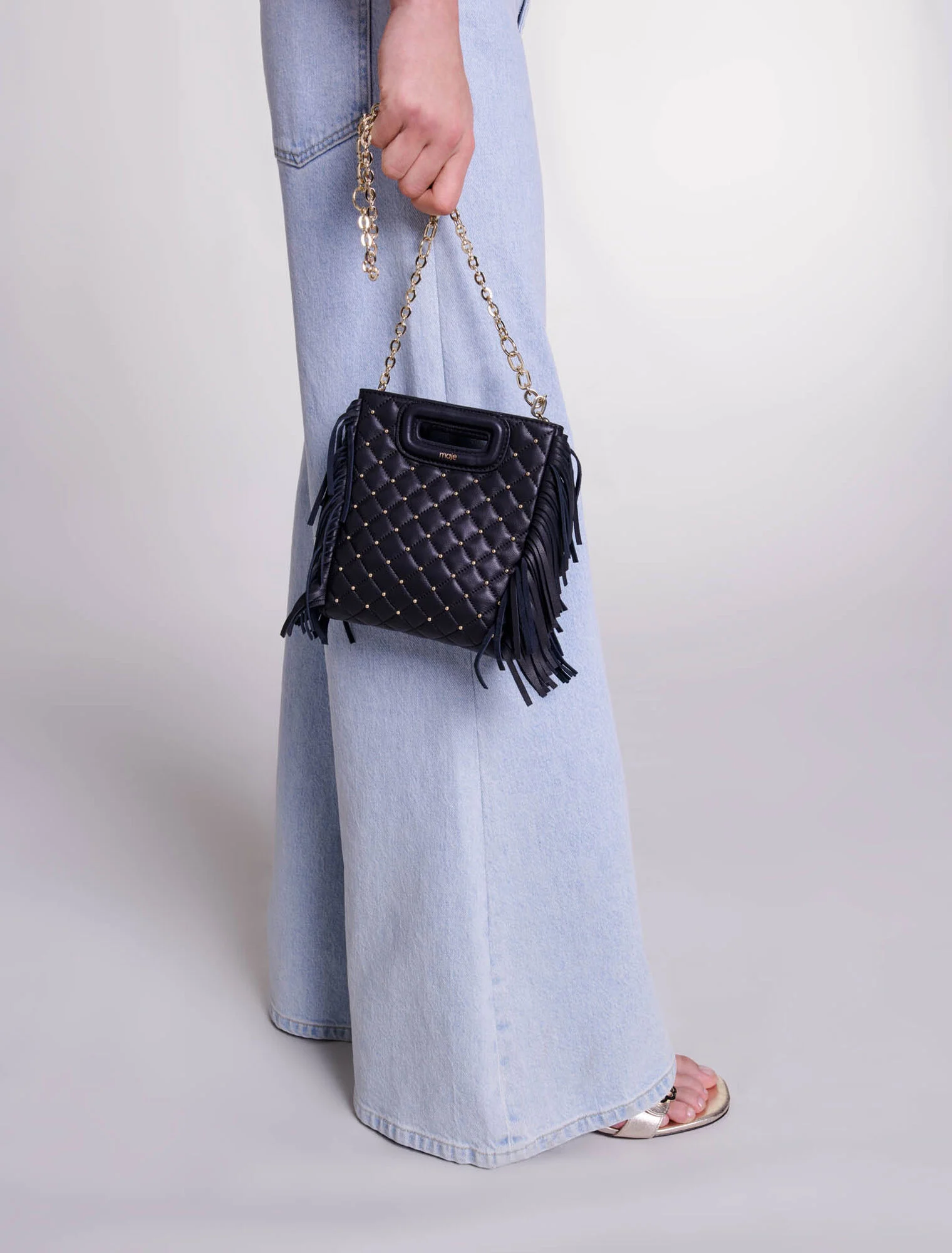 Studded M quilted leather mini bag