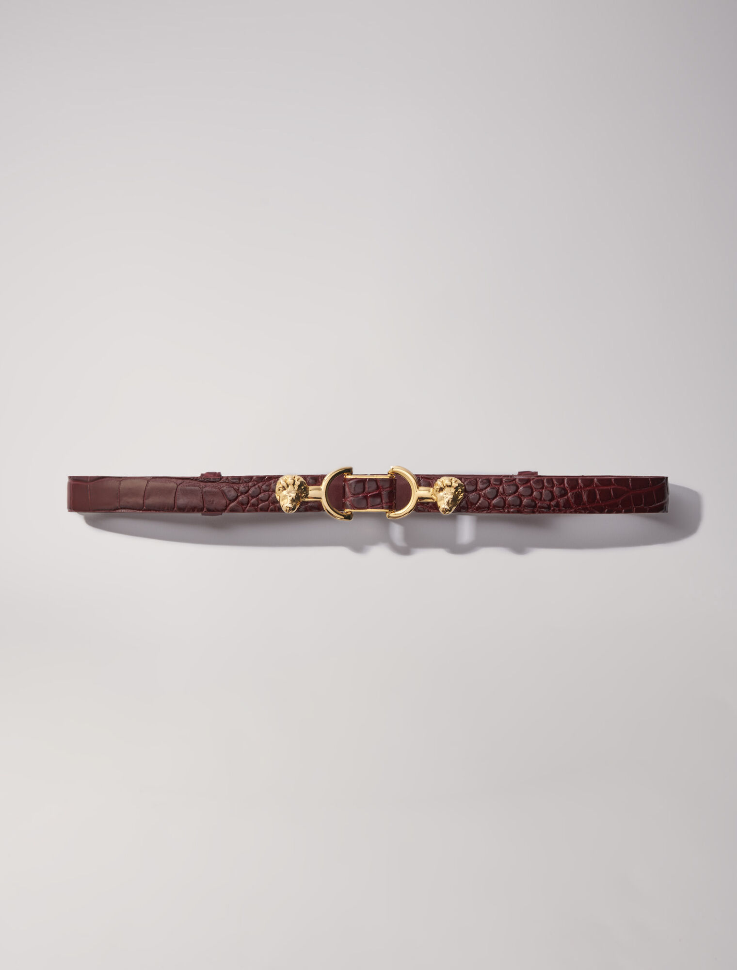 Embossed leather and lion horsebit belt