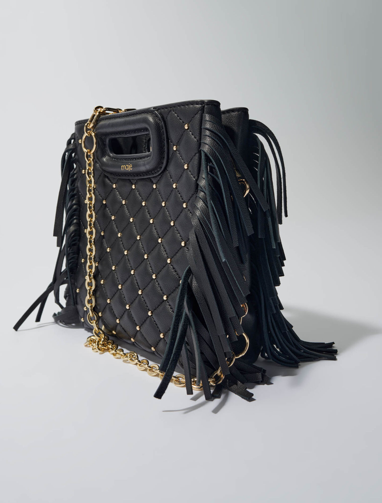 Studded M quilted leather mini bag