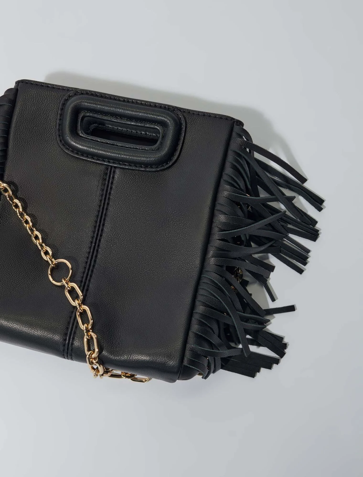 Studded M quilted leather mini bag