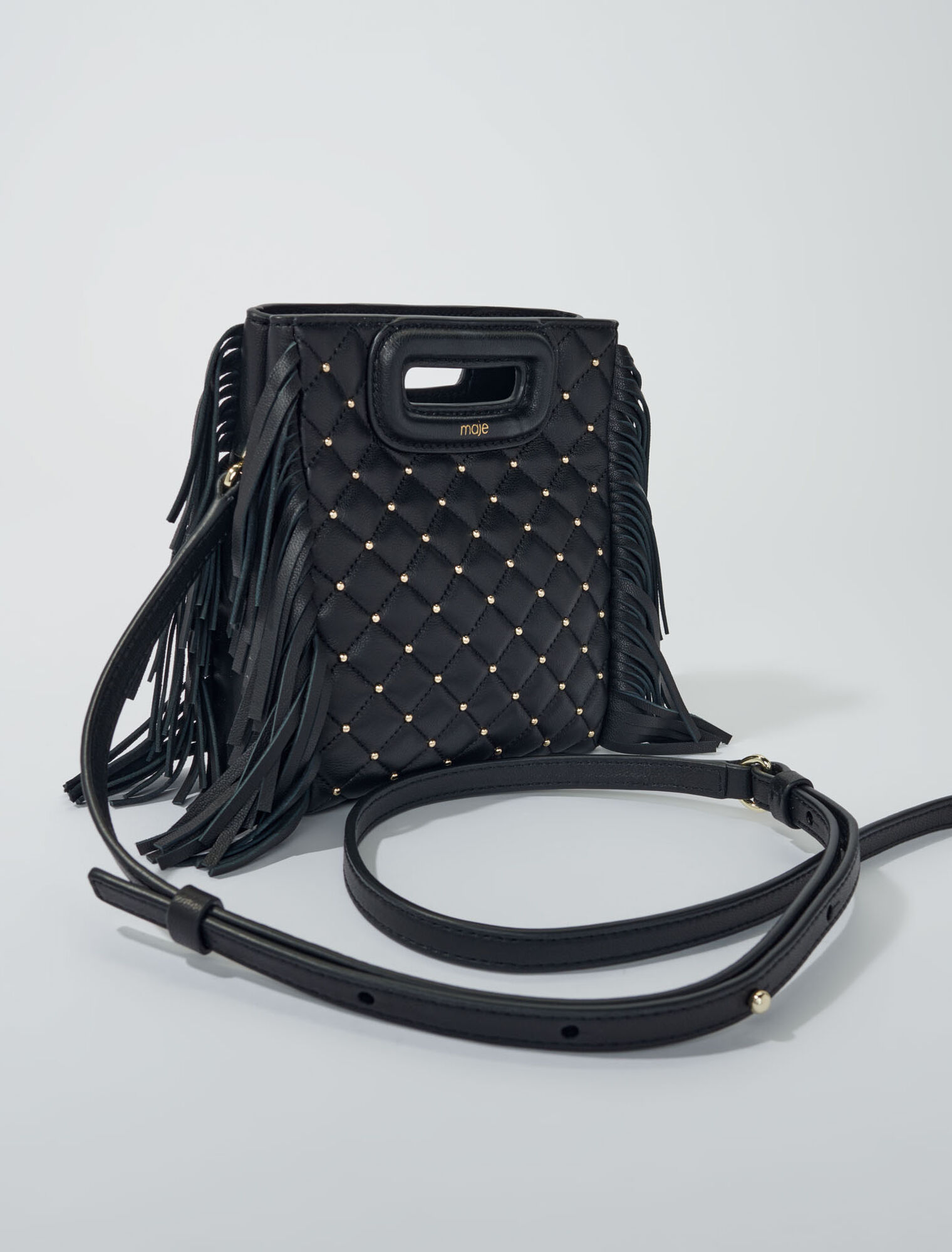 Studded M quilted leather mini bag