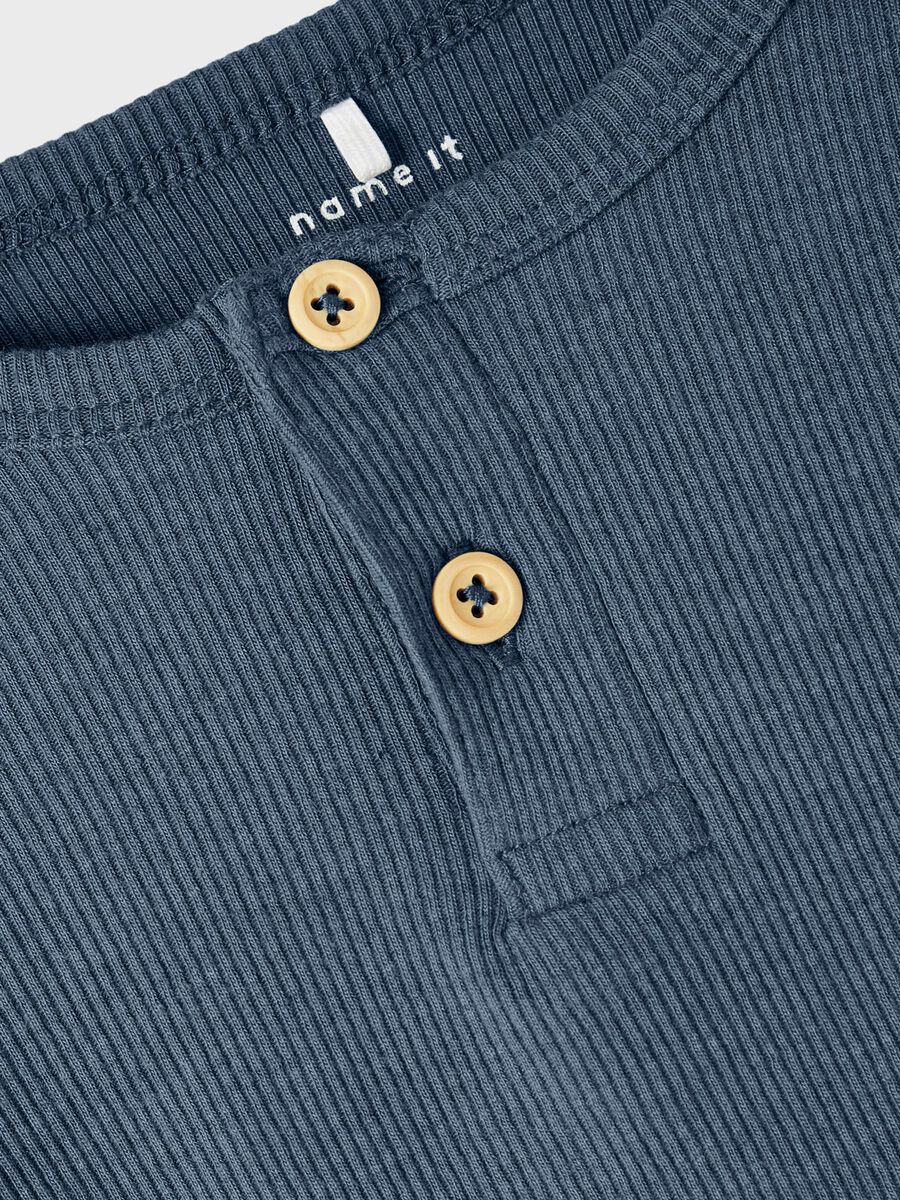 GERIBDE KNOOP TOP MET LANGE MOUWEN