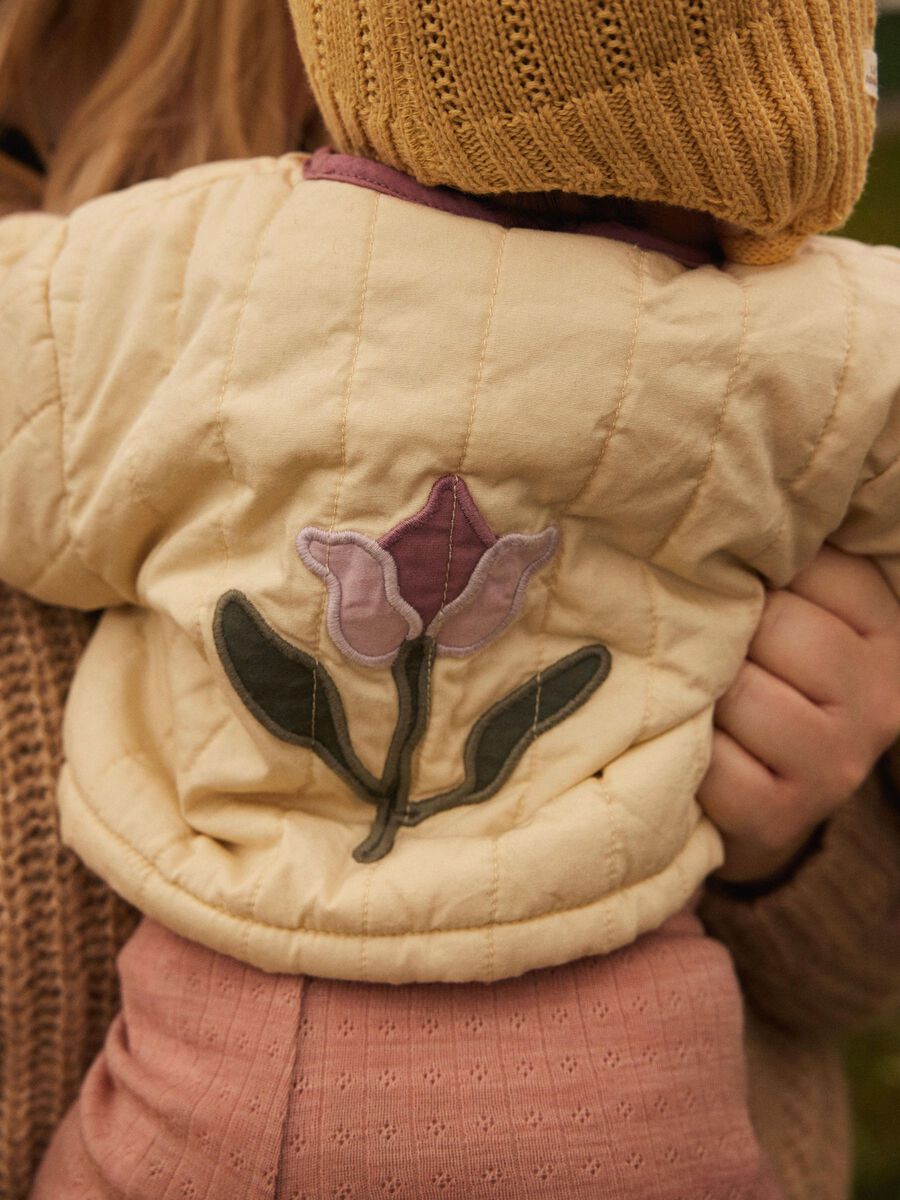 GEBORDUURD GEWATTEERDE JAS