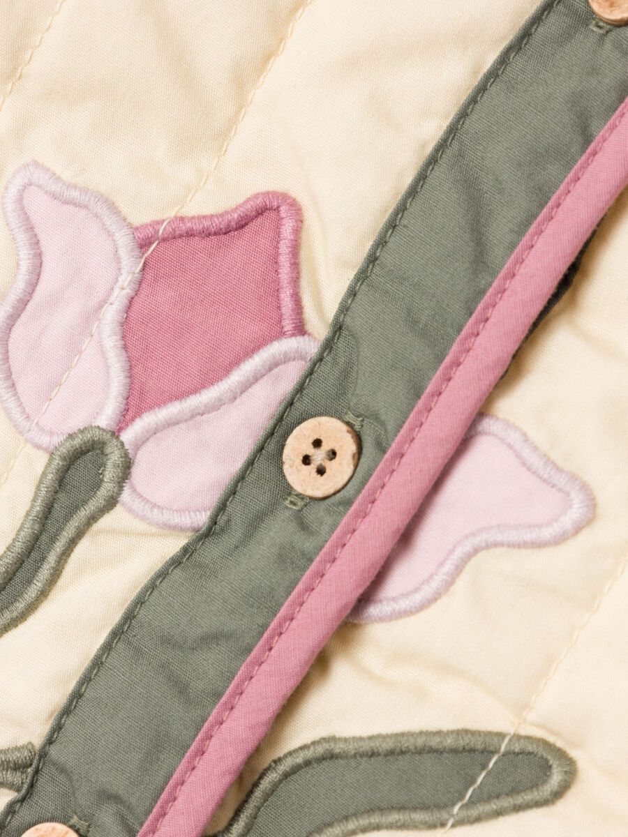 GEBORDUURD GEWATTEERDE JAS