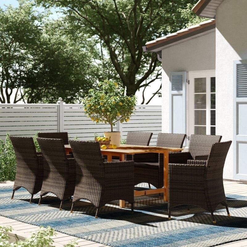 Decastro Rectangular 8 - Person 67'' Long Dining Set with Cushions