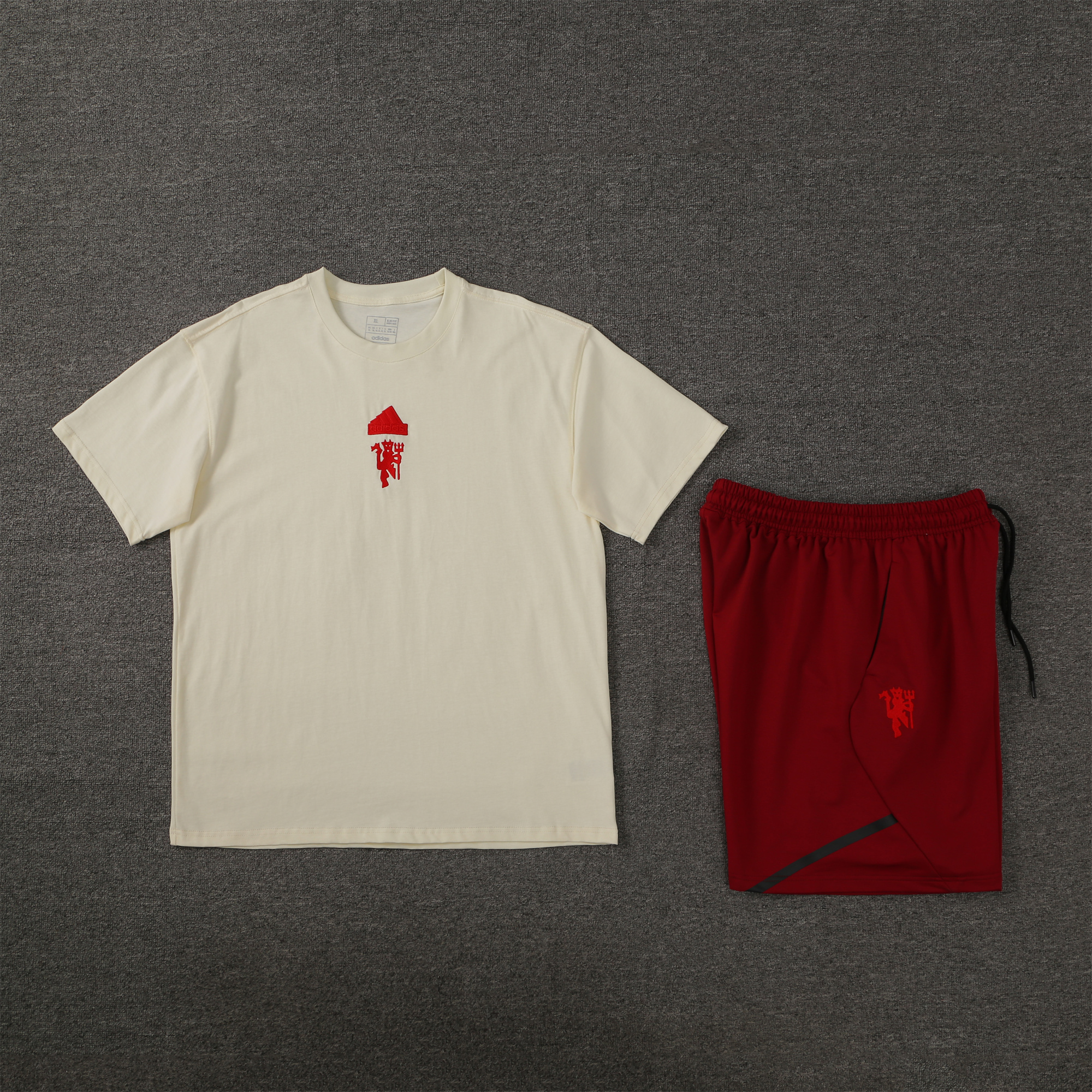 Manchester United 24-25 Short-Sleeve Training Set - Milky White Top & Red Shorts - ReplicasJersey